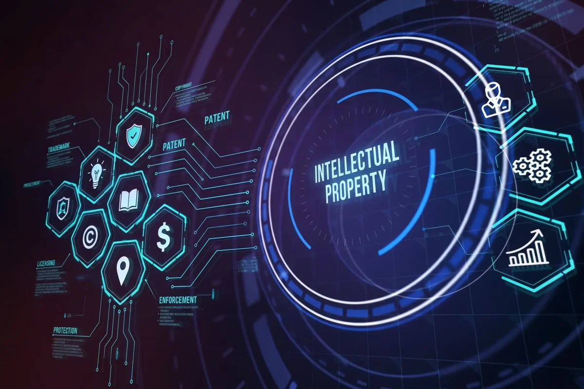 A futuristic, high-tech digital interface featuring a central glowing blue circle with the text "INTELLECTUAL PROPERTY." To the right, three glowing hexagonal icons display a person in a suit, interlocking gears, and an upward-trending bar graph. The background is a dark, abstract blend of purple and blue geometric digital elements.